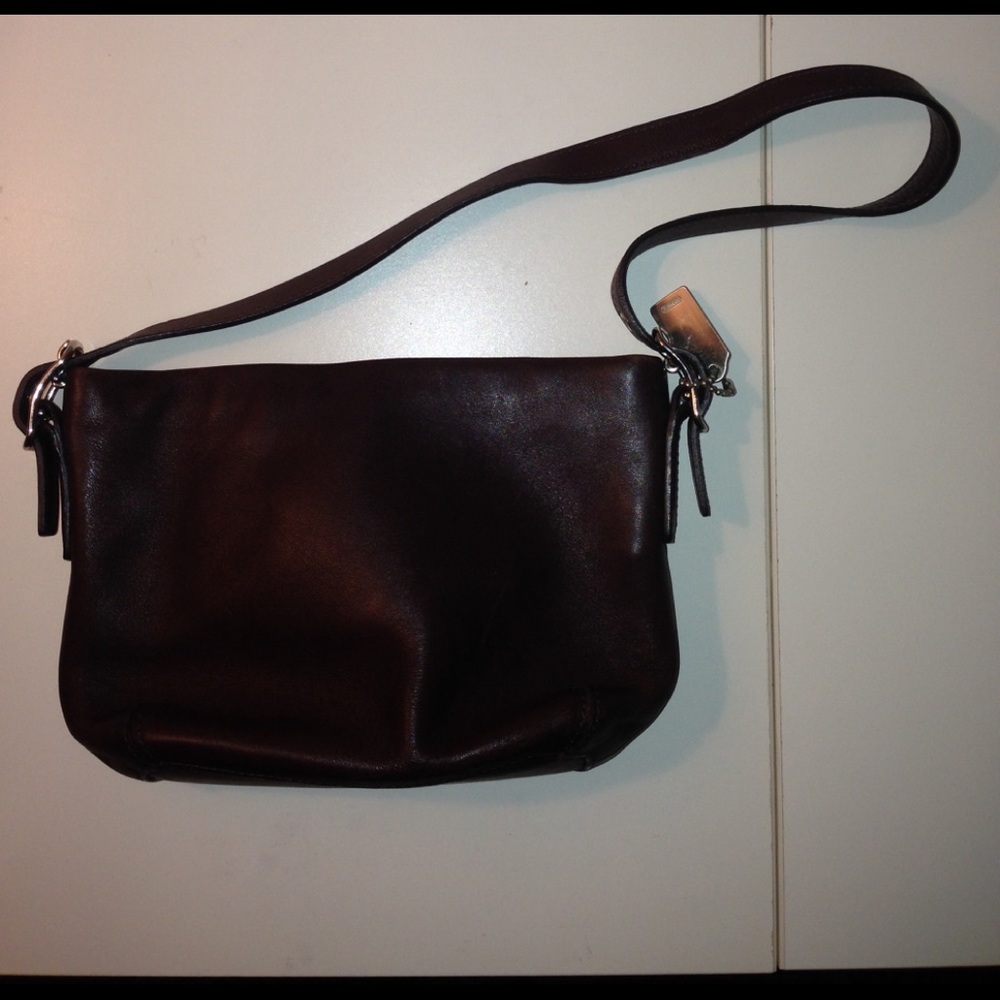 Small brown leather Coach purse.